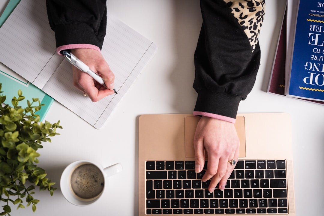 blogger writing content on laptop