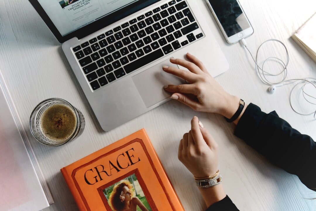 blogger writing content on laptop