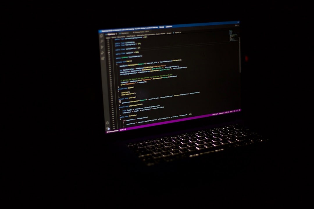 programmer coding on laptop